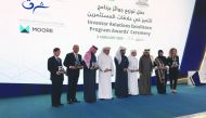 The 2019 Annual Investor Relations Excellence Program award winners posing for a group picture with Qatar Stock Exchange Chief Executive Officer, Rashid bin Ali Al Mansoori (centre).