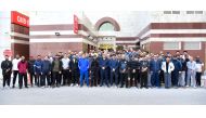 QIIB Chief Executive Officer, Dr Abdulbasit Ahmed Al Shaibei, with other employees of the Bank posing for a group photo at QIIB headquarters in Doha,  after the National Sport Day celebrations, yesterday. 