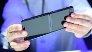 A member of the media holds a Samsung Galaxy Z Flip phone during the Samsung Galaxy Unpacked 2020 event in San Francisco, California on February 11, 2020. AFP / Josh Edelson
 