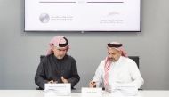 Nasser Ahmed Al Shaibi (left), CEO of the QFMA, and Yousuf Mohamed Al Jaida, CEO and Board Member of the QFCA, signing the MoU.