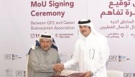 H E Ahmad bin Mohammed Al Sayed (right), Minister of State and Chairman of Qatar Free Zones Authority, and Sheikh Faisal bin Qasim Al Thani,  Chairman of Qatar Businessmen Association (QBA), after signing the MoU at the Business Innovation Complex in Ras 