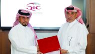 Ali Saleh Al Fadala (right), Senior Deputy Group President & CEO of QIC Group presenting the award to one of the long-serving employees at the ceremony. 