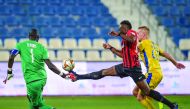 Al Rayyan's Yohan Boli (centre) controls the ball during yesterday's match. 