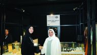 Qatar Chamber’s Board Member and Chairperson of Qatari Businesswomen Forum, Ebtihaj Al Ahmadani (left) greet one of the participants during the event.