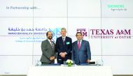 Officials posing for a photo during the announcement of collaboration between Siemens, Texas A&M University and Hamad Bin Khalifa University.