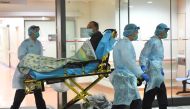 Medical staff transfer a patient of a suspected case of a new coronavirus at the Prince of Wales Hospital in Hong Kong, China, January 22, 2020. cnsphoto via Reuters