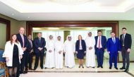 QBA Chairman Sheikh Faisal bin Qassim Al Thani, QBA Board members and officials posing for a photo with the visiting Minister of Georgia, Natella Turnava (fifth right), and her accompanying delegation in Doha, yesterday.
