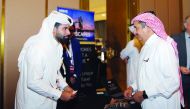 Qatar Chamber Chairman Sheikh Khalifa bin Jassim Al Thani (right), touring the exhibition at the 3rd SMEs Conference, in Doha yesterday. 