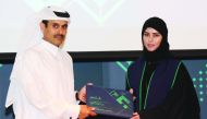 H E Saad bin Sherida Al Kaabi, the Minister of State for Energy Affairs, the President and CEO of Qatar Petroleum, giving away a certificate of appreciation to a Qatari graduate during the event.