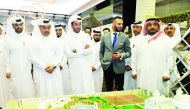 H E Ali bin Ahmed Al Kuwari (second left), Minister of Commerce and Industry, with Abdulaziz bin Nasser Al Khalifa (left), the CEO of Qatar Development Bank, and other officials during the tour after the opening of ‘Build Your House 2020 Exhibition’ at QN