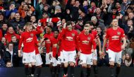 Soccer Football - Premier League - Manchester United v Manchester City - Old Trafford, Manchester, Britain - March 8, 2020 Manchester United's Anthony Martial celebrates scoring their first goal with teammates REUTERS/Phil Noble 