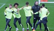 In this file photo taken on February 25, Manchester City’s players  attend a  team training session at City Football Academy in Manchester.