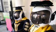 This undated handout photo released by the University Sultan Zainal Abidin on June 2, 2020 shows two robots named Seebaa (R) and Naseem (L) wearing graduation robes are pictured during a simulation in Terengganu. AFP PHOTO / UNIVERSITY SULTAN ZAINAL ABIDI