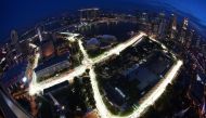 FILE PHOTO: An aerial view shows the illuminated Marina Bay street circuit of the Singapore Formula One Grand Prix at dusk in Singapore September 20, 2010. Picture taken with a fish-eye lens. REUTERS/Edgar Su/File Photo
