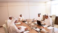 Sheikh Mohammed bin Hamad bin Jassim Al Thani (centre) Chairman and Managing Director of Barwa Bank and other Board Members addressing the Ordinary General Assembly, which was held through virtual video conferencing technology, yesterday. 