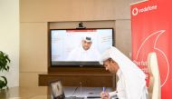 Khames Mohammed Al Naimi, Vodafone Qatar’s Chief Human Resources Officer, and EAA’s Director of Procurement and Operations, Mohammed Saad Al Kubaisi (in the screen), signing the agreement during a virtual meeting held yesterday. 