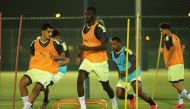 Al Duhail's star striker Almoez Ali (centre) and his teammates in action during a training session held yesterday.
