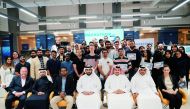 A file photo of officials and participants of Qatar SportsTech during its Hackathon contest in February. 