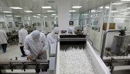FILE PHOTO: Pharmacists at a Hikma Pharmaceuticals plant package tablets, February 8, 2011. Picture taken February 8, 2011. REUTERS/Ali Jarekji/File Photo