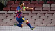 Barcelona's Argentine forward Lionel Messi celebrates after scoring a goal during the UEFA Champions League round of 16 second leg football match between FC Barcelona and Napoli at the Camp Nou stadium in Barcelona on August 8, 2020. / AFP / LLUIS GENE