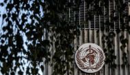 A photo taken in the late hours of August 17, 2020 shows a sign of the World Health Organization (WHO) at their headquarters in Geneva amid the COVID-19 outbreak, caused by the novel coronavirus. / AFP / Fabrice COFFRINI