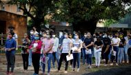 Students wearing protective face masks wait to enter an examination centre for Joint Entrance Examination (JEE), amidst the spread of the coronavirus disease (COVID-19), in Ahmedabad, India, September 1, 2020. REUTERS/Amit Dave
