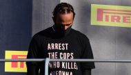 Formula One F1 - Tuscan Grand Prix - Mugello, Scarperia e San Piero, Italy - September 13, 2020 Mercedes' Lewis Hamilton wears a shirt in reference to Breonna Taylor on the podium as he celebrates after winning the race Pool via REUTERS/Jennifer Lorenzini