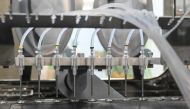 Filling and packaging tests for the large-scale production and supply of the University of Oxford’s COVID-19 vaccine candidate, AZD1222, are being conducted on a high-performance aseptic vial filling line on September 11, 2020 at the Italian biologics’ ma