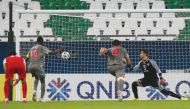 Al Duhail’s forward Almoez Ali (left) scores from a penalty spot against Iran’s Persepolis,  yesterday. 