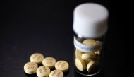 Tablets of Avigan (generic name : Favipiravir), developed by drug maker Toyama Chemical Co, a subsidiary of Fujifilm Holdings Co. are displayed during a photo opportunity at Fujifilm's headquarters in Tokyo October 22, 2014. REUTERS/Issei Kato/File Photo