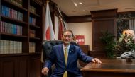 FILE PHOTO: Japanese Chief Cabinet Secretary Yoshihide Suga poses for a picture following his press conference at LDP (Liberal Democratic Party) headquarters, in Tokyo, Japan September 14, 2020. Nicolas Datiche/Pool via REUTERS/File Photo
