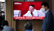 People watch a television news broadcast showing file footage of North Korean leader Kim Jong Un, at a railway station in Seoul on September 25, 2020. North Korean leader Kim Jong Un apologised on September 25 over the killing of a South Korean at sea, ca