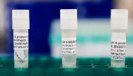 In this file photo three potential coronavirus, COVID-19, vaccines are kept in a tray at Novavax labs in Gaithersburg, Maryland on March 20, 2020, one of the labs developing a vaccine for the coronavirus, COVID-19. US biotech firm Novavax said Ton Septemb