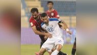 Players vie for the ball during the Ooredoo Cup Group B Round 1 match between Al Kharaitiyat and Al Rayyan yesterday.