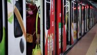 A woman wearing a protective face mask is seen in a Light Rail Transit train at a station, amid the coronavirus disease (COVID-19) outbreak in Kuala Lumpur, Malaysia October 1, 2020. REUTERS/Lim Huey Teng
