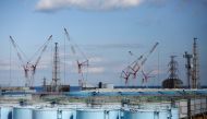FILE PHOTO: The reactor units No.1 to 4 are seen over storage tanks for radioactive water at Tokyo Electric Power Co's (TEPCO) tsunami-crippled Fukushima Daiichi nuclear power plant in Okuma town, Fukushima prefecture, Japan February 18, 2019. REUTERS/Iss