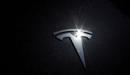 FILE PHOTO: The Tesla logo is seen on a car in Los Angeles, California, U.S., July 9, 2020. REUTERS/Lucy Nicholson/File Photo
