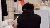 FILE PHOTO: A man gets an influenza vaccine at a hospital in Seoul, South Korea, October 21, 2020. REUTERS/Kim Hong-Ji/File Photo
