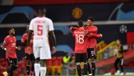 Manchester United's English striker Marcus Rashford (R) celebrates scoring his team's third goal, his second, with Manchester United's Portuguese midfielder Bruno Fernandes, during the UEFA Champions league group H football match between Manchester United