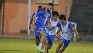 Al Markhiya's players in action during a training session, yesterday