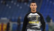 In this file photo taken on September 27, 2020 Juventus' Portuguese forward Cristiano Ronaldo warms up prior to the Italian Serie A football match Roma vs Juventus at the Olympic stadium in Rome.  / AFP / Tiziana FABI