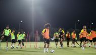 Al Sadd's Akram Afif with team-mates during a practice session on the eve of their Amir Cup semi-final against Al Duhail. Bottom: Al Duhail players during a practice session.