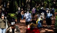 People take a walk as they wear masks to avoid the spread of the coronavirus disease (COVID-19) at a park in Seoul, South Korea, October 5, 2020. REUTERS/Kim Hong-Ji
