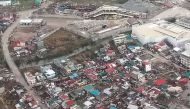 This handout photo taken and received from the Philippine Coast Guard on November 2, 2020 shows an aerial view of damaged buildings on the island province of Catanduanes, in the aftermath of Typhoon Goni. / AFP