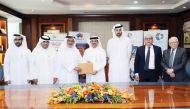 Qatar Aluminium Extrusion Co (QALEX) Chairman, Abdul Rahman bin Abdullah Al Ansari (centre) with other officials at the signing ceremony of the agreement in Doha, recently. 