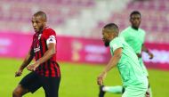 Al Rayyan's Yacine Brahimi (left) in action during yesterday's match.