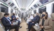 The Olympic Council of Asia Evaluation Committee members and officials taking a ride in Doha Metro.