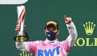 Formula One F1 - Turkish Grand Prix - Istanbul Park, Istanbul, Turkey - November 15, 2020 Racing Point's Sergio Perez celebrates on the podium with a trophy after finishing the race in second place Pool via REUTERS/Ozan Kose
