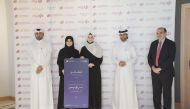 Amit Sah, EGM and Head of Retail Banking at Commercial Bank, with other officials from Commercial Bank and Qatar University awarding the student winners at a ceremony held at Qatar University, in Doha, recently. 