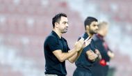 Coach Xavi Hernandez applauds after Al Sadd won their QNB Stars League match against Al Arabi on Sunday.    